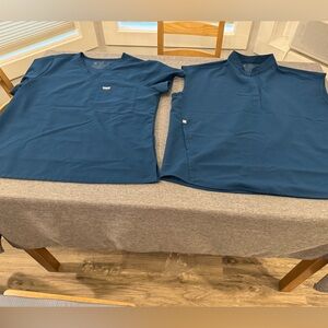 Figs scrubs sizes medium, medium petite, and large.